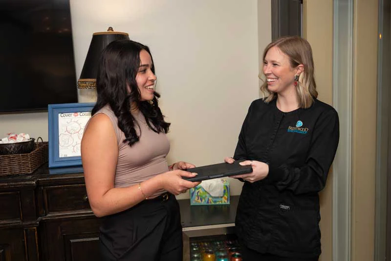 woman smiling during her visit to Brentwood Dental Excellence
