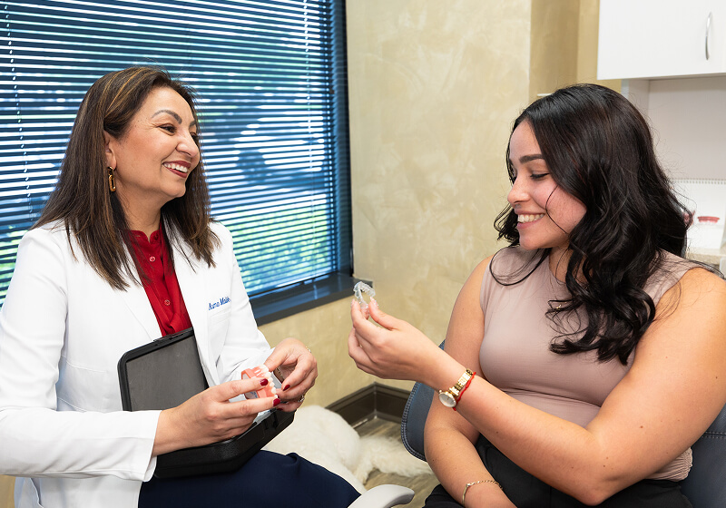 patient discussing Invisalign aligners at Brentwood Dental Excellence